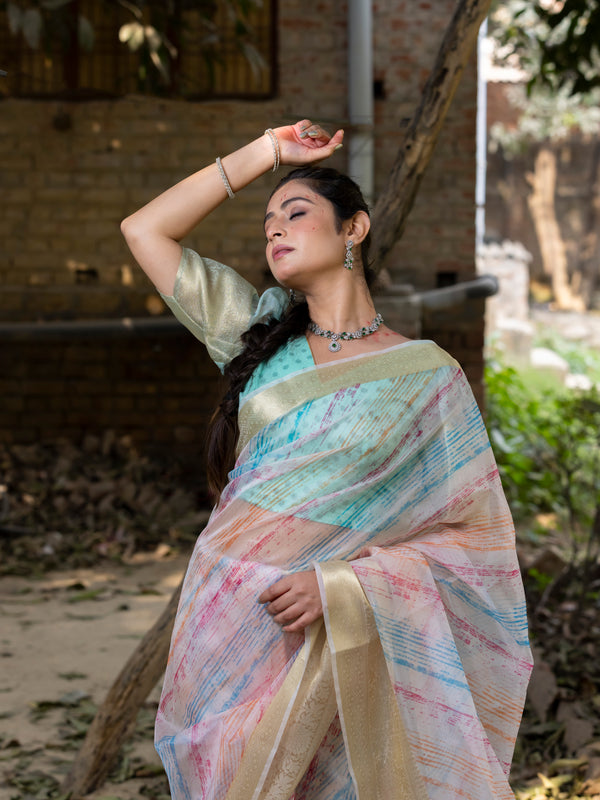 Off White Vibrant Organza Silk Saree with Mesmerizing Digital Print and Zari Border
