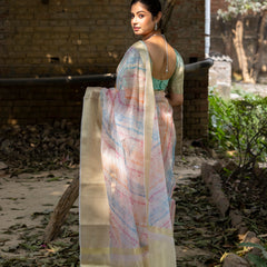 Off White Vibrant Organza Silk Saree with Mesmerizing Digital Print and Zari Border