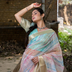 Off White Vibrant Organza Silk Saree with Mesmerizing Digital Print and Zari Border