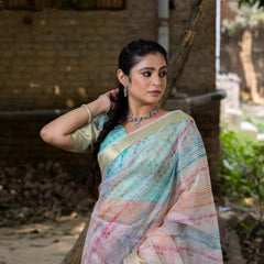 Off White Vibrant Organza Silk Saree with Mesmerizing Digital Print and Zari Border