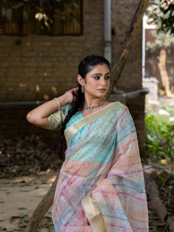 Off White Vibrant Organza Silk Saree with Mesmerizing Digital Print and Zari Border
